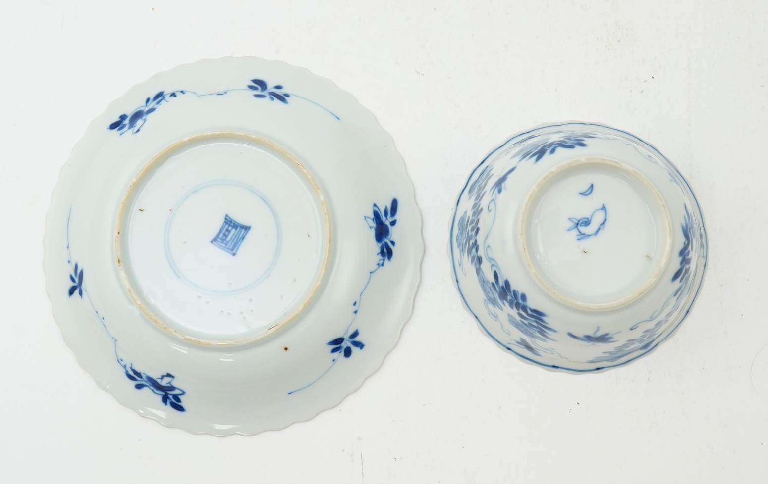 A Chinese blue and white tea bowl and saucer, Kangxi period